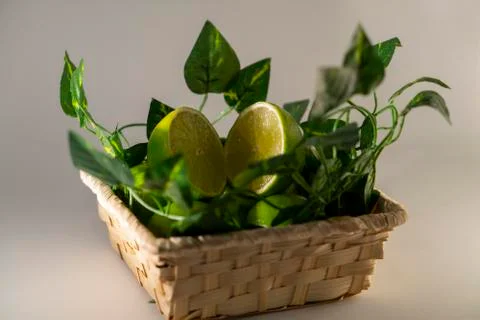 Lime in basket Stock Photos
