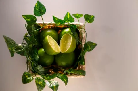 Lime in basket Stock Photos
