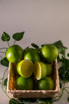 Lime in basket Stock Photos
