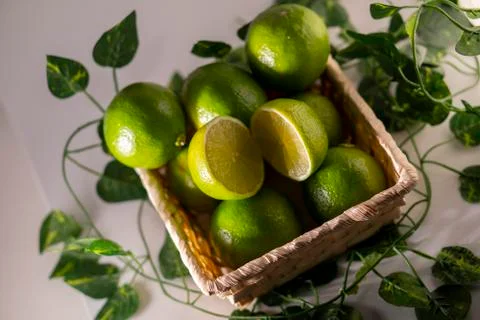 Lime in basket Stock Photos