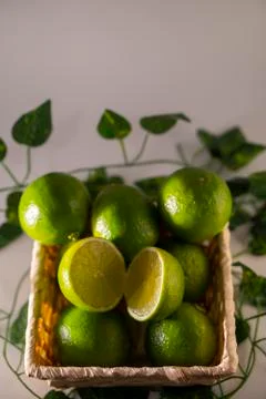 Lime in basket Stock Photos