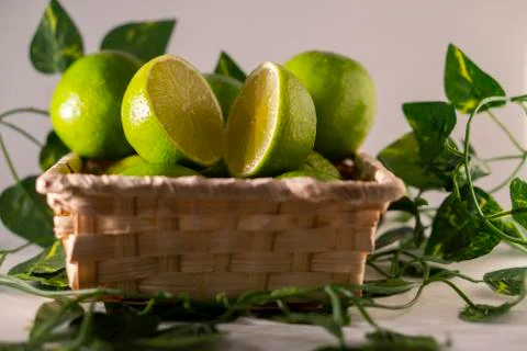 Lime in basket Stock Photos