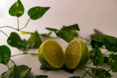 Lime in basket Stock Photos