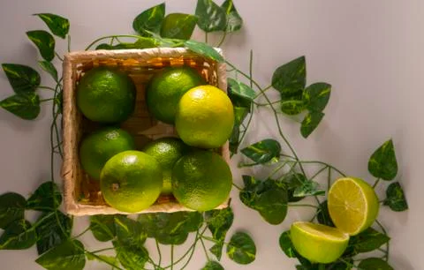 Lime in basket Stock Photos