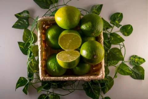 Lime in basket Stock Photos