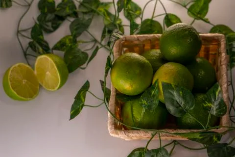 Lime in basket Stock Photos