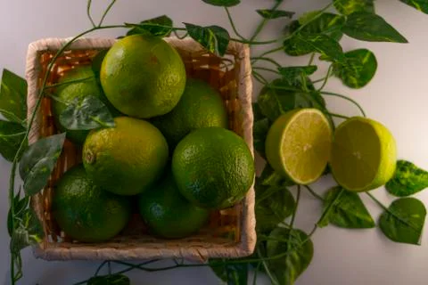 Lime in basket Stock Photos