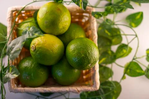 Lime in basket Stock Photos