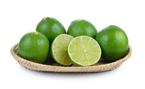 Lime in the basket on white background Stock Photos