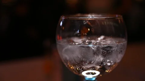 Lime being dropped into a Cocktail Stock Footage 102009940