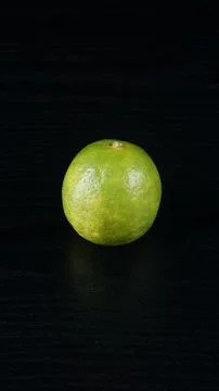 A Lime on a black table Stock Photos