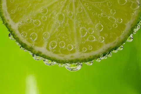 Lime in the bubbles Stock Photos