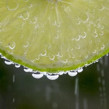 Lime in the bubbles Stock Photos