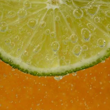 Lime in the bubbles Stock Photos