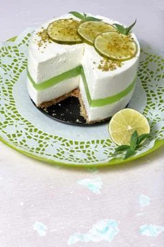 Lime cheesecake without baking. Decorated with lime slices. The piece is cut  Stock Photos