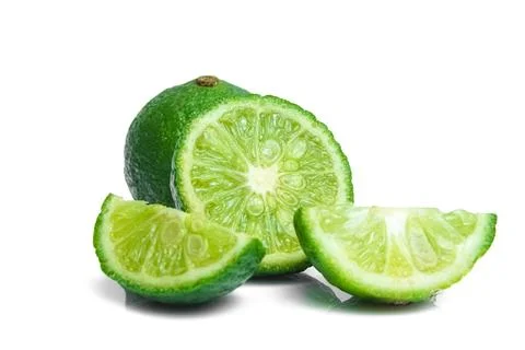 Lime closeup isolated on white background. Stock Photos