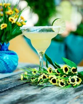 Lime cocktail garnished with lime slice in glass decorated with sugar sprinkles Stock Photos