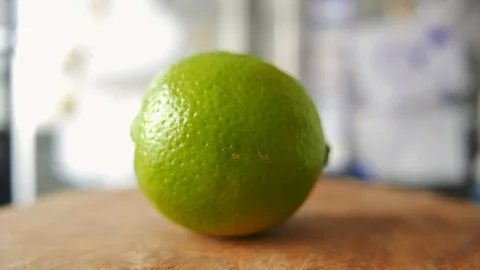 Lime cut in half with a knife Stock Footage