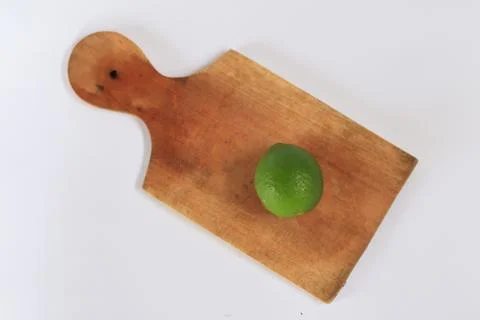 Lime on a cutting board with a white background Stock Photos