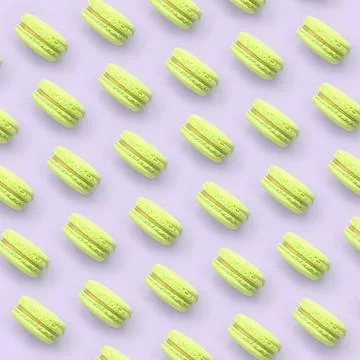 Lime dessert cake macaron or macaroon on trendy pastel lilac background top v Stock Photos