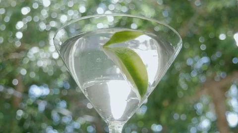 Lime Drops into a Martini Cocktail in 4k Stock Footage 75916430