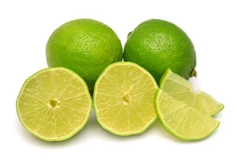 Lime fruit whole, half and slices isolated on a white background. Creative .. Stock Photos