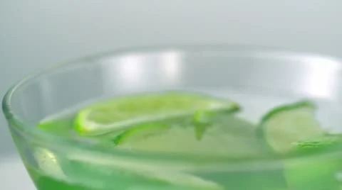 Lime in glass of water, Slow Motion Stock Footage