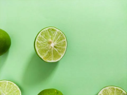 Lime on green background Stock Photos