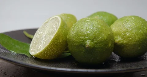 Lime green lemon rotating studio close-up Видео 101476945