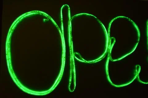 Lime green lighting with specific pattern with inscription, letters open neon. Foto stock