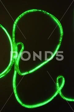Lime green lighting with specific pattern with inscription, letters open neon. Stock Photos
