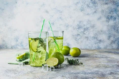 Lime Lemonade with thyme and ice. Stock Photos