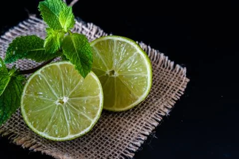Lime with mint on rustic background Stock Photos