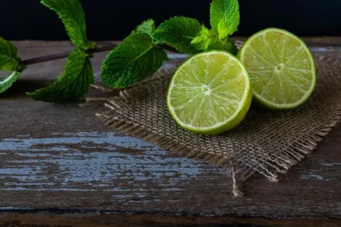 Lime with mint on rustic background Stock Photos