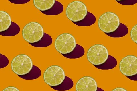 Lime pattern on a orange background. Pop art design, creative citruses. Yellow Illustrazione stock