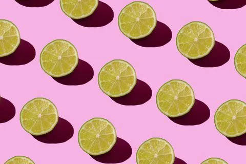 Lime pattern on a pink background. Pop art design, creative citruses. Yellow Stock Photos