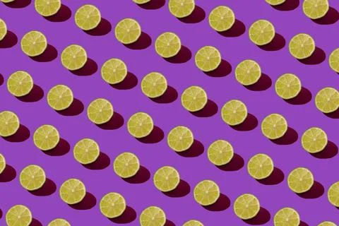 Lime pattern on a purple background. Pop art design, creative citruses. Yellow Stock Photos