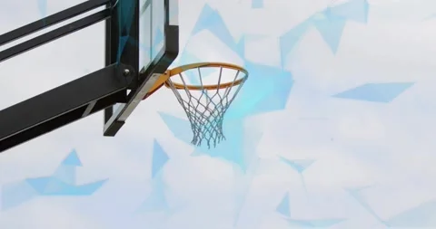 Lime player driving layup to score, defender jumping, ball arcing through hoop Stock Footage 321824494