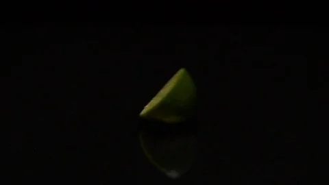 Lime rolls out on a black table 库存影片 80599588
