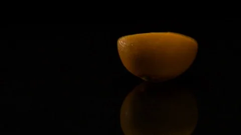 Lime rolls out on a black table Video stock 80603207