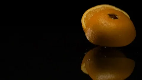 Lime rolls out on a black table Stock Footage 80603968