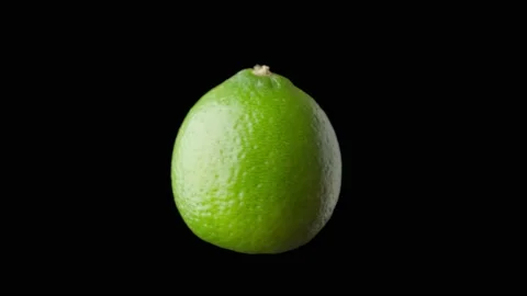 Lime rotates on a black background, isolated. Video stock 168409540