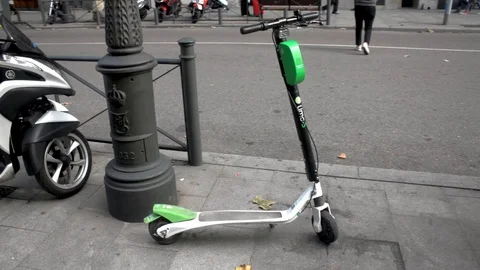 Lime s electric sharing scooter parked Stock Footage 97498073