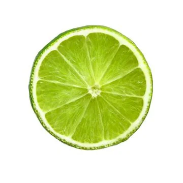Lime slice. Juicy slice of lime. Ripe green lime citrus fruit. Stock Photos