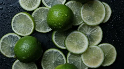 Lime slices closeup, macro background, fruits top view. Rotate. fresh lime for Stock Footage 148409533