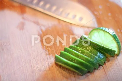 Lime slices on cutting board Stock Photos