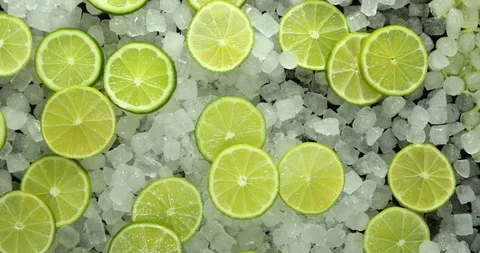 Lime Slices on top of Ice Cubes, Slow Zoom Out and Subtle Rotation, 4K 스톡 동영상 116490483