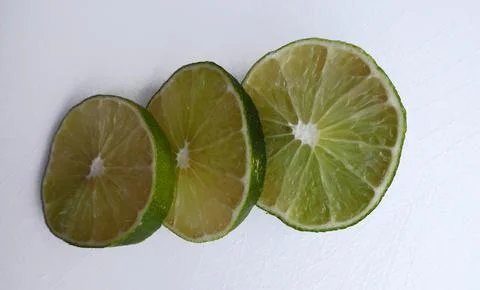 Lime slices on white Stock Photos