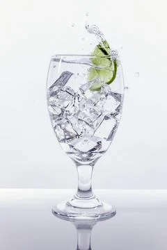 Lime splashes in water. Stock Photos