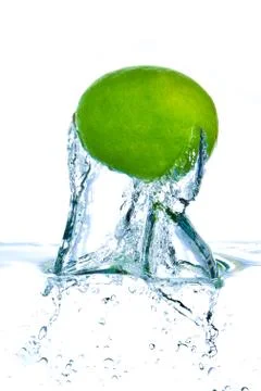 Lime splashing Stock Photos